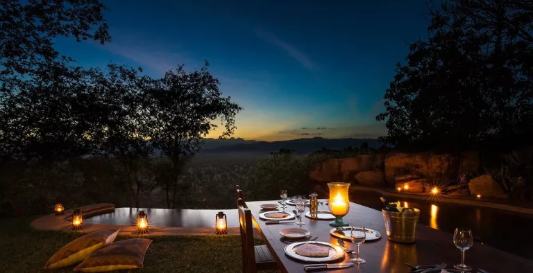 Family travel adventures-a candle-lit bush dinner setting with an incredible view
