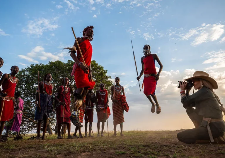Luxury safari lodge- masai morans perform the adumu dance