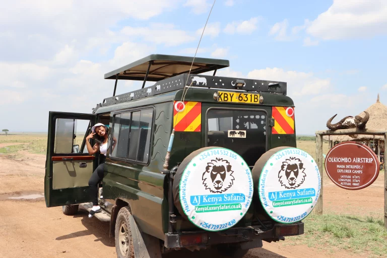 Kenya safari October- a woman poses inside an AJ Kenya Safaris van
