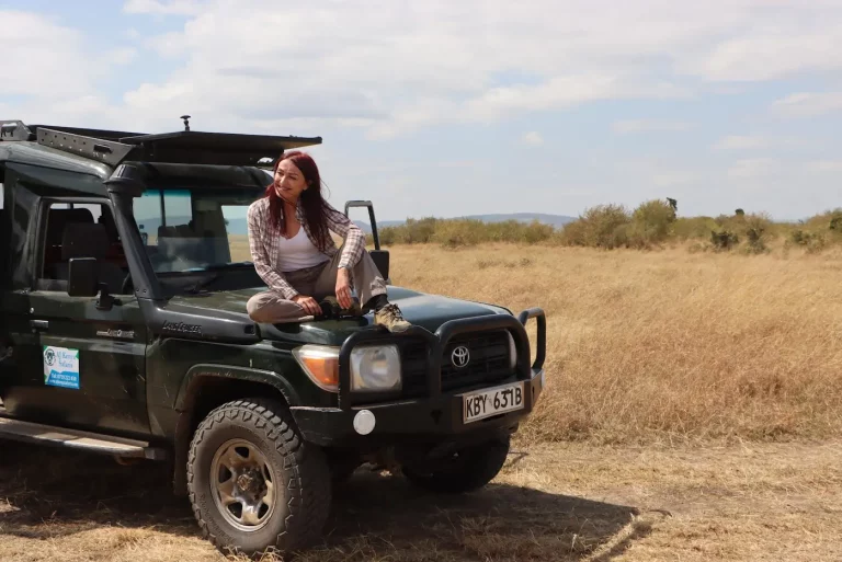 Safari trip south africa- woman on a game drive in the mara