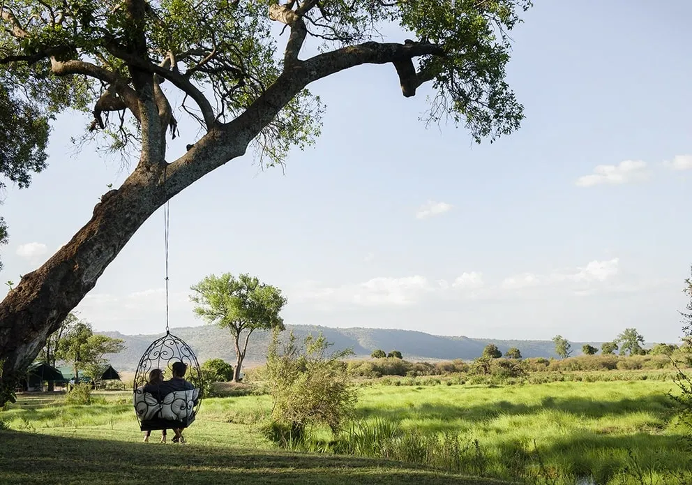 Best Kenya safari packages prices - a couple relaxing at Governors Camp