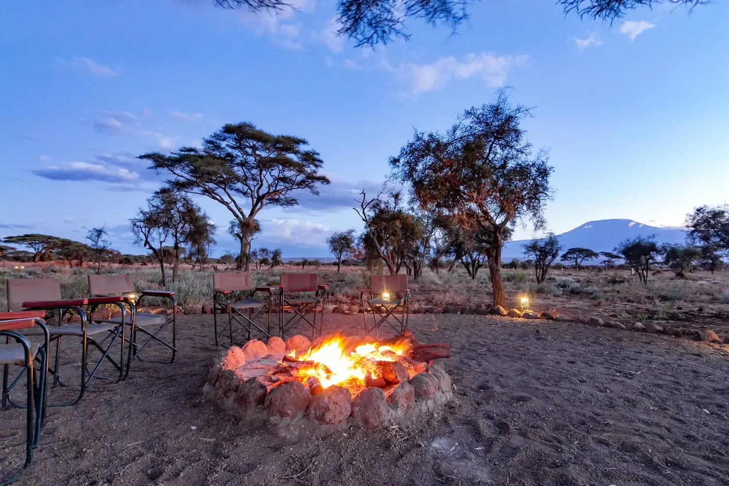 Bonfire at a luxury Kenya safari lodge in Masai Mara