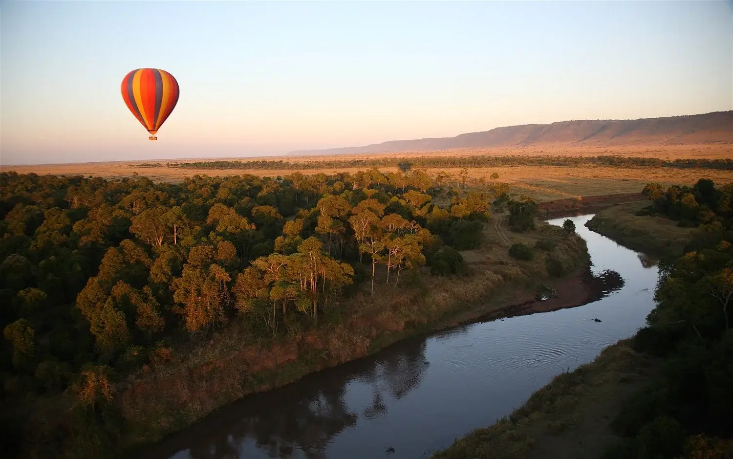 Kenya family holidays to the Masai Mara - a hot air balloon floating over the Mara