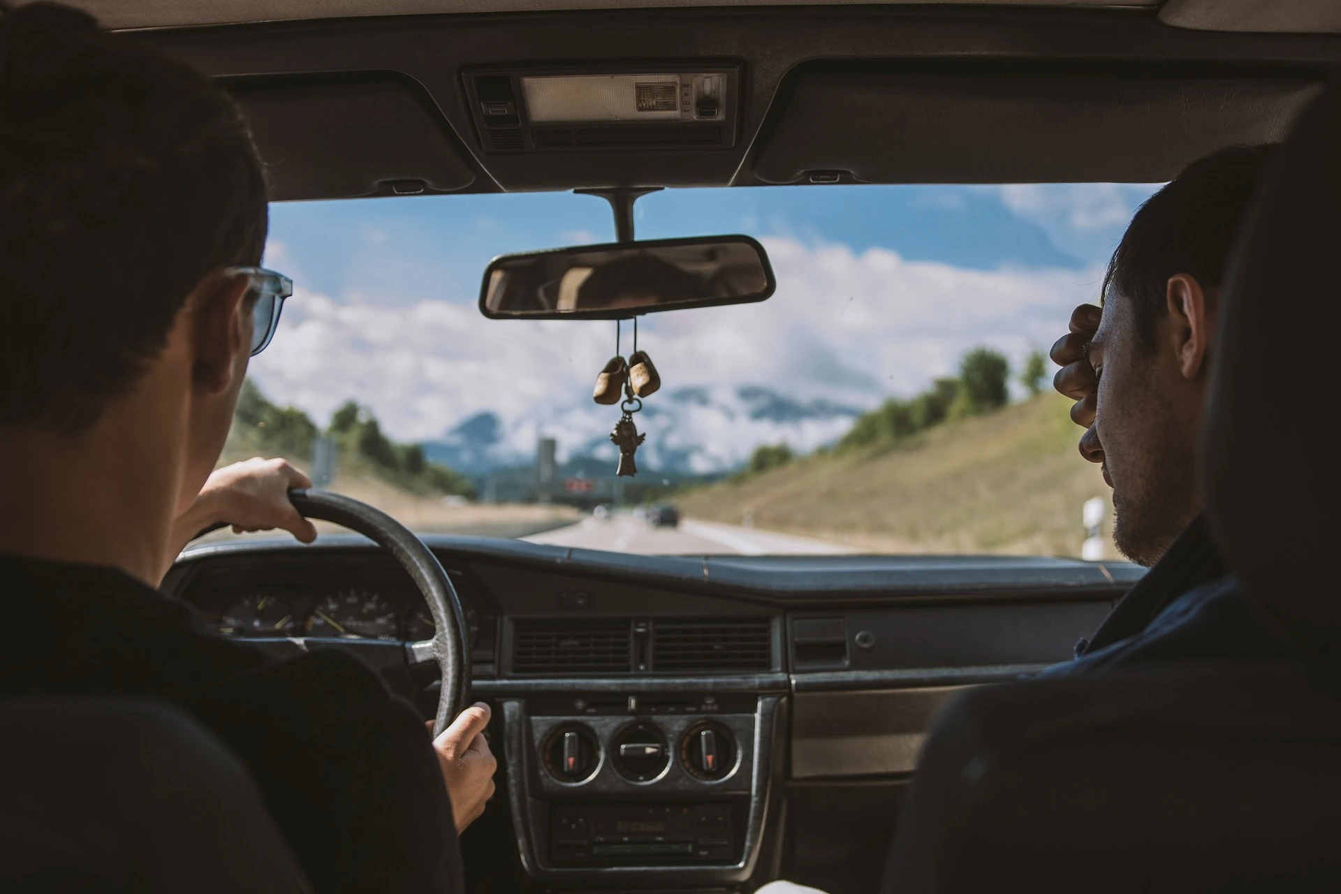 A Self Drive Car Hire Scene in Kenya, Highlighting a Car on a Scenic Road