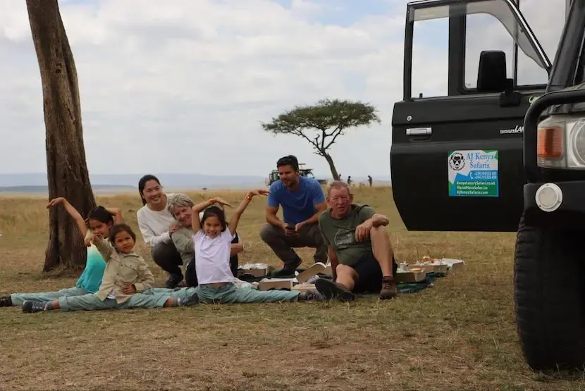 What is the Kenya safari cost for family travel - a family enjoying safari in Masai Mara